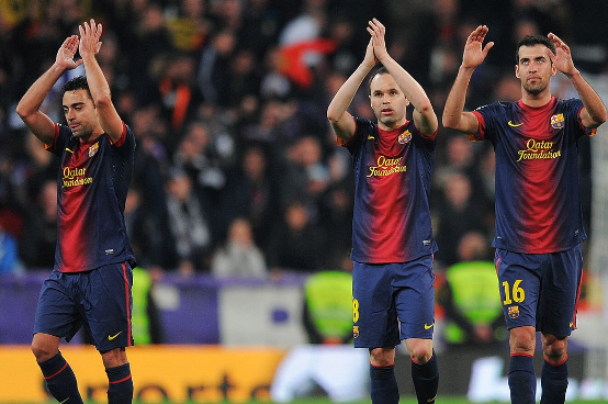 Xavi, Andres Iniesta, and Sergio Busquets 